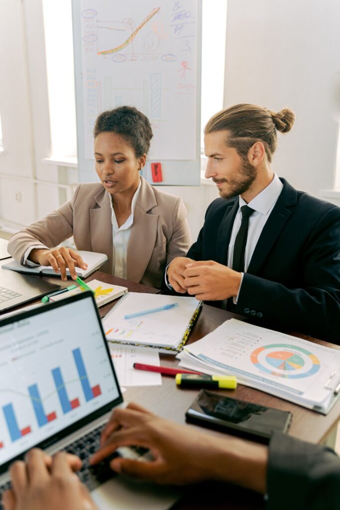 A man and woman working in the office