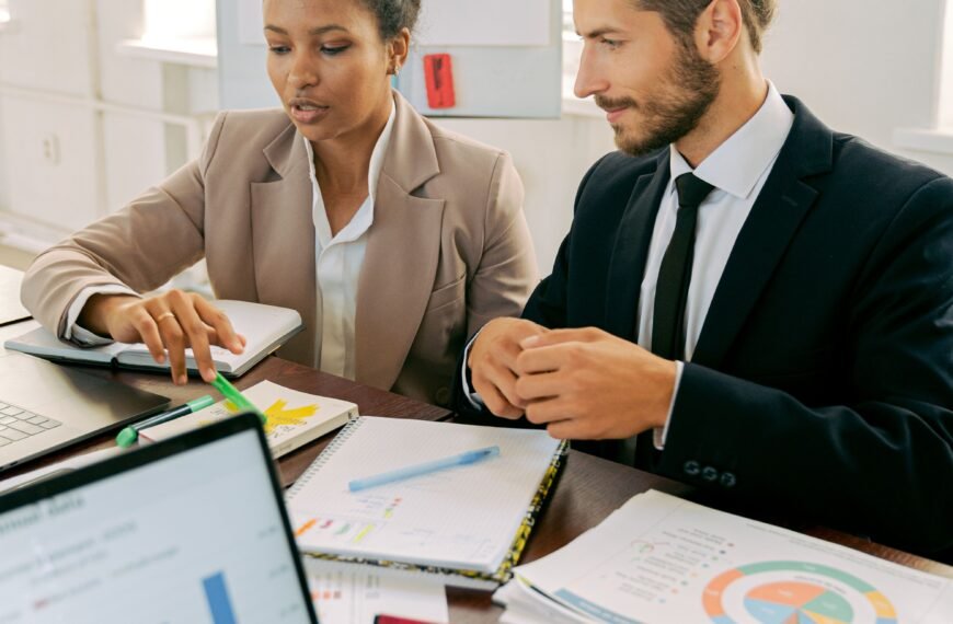 A man and woman working in the office